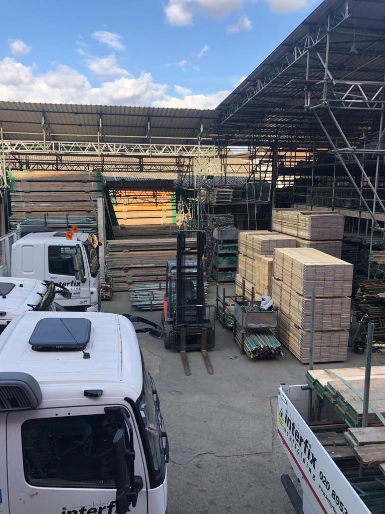 Interfix scaffolding yard with stacked timber